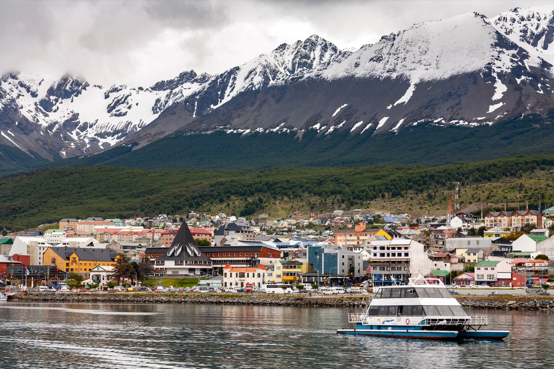 Ushuaia beneath snow-covered mountains at the southern tip of Argentina