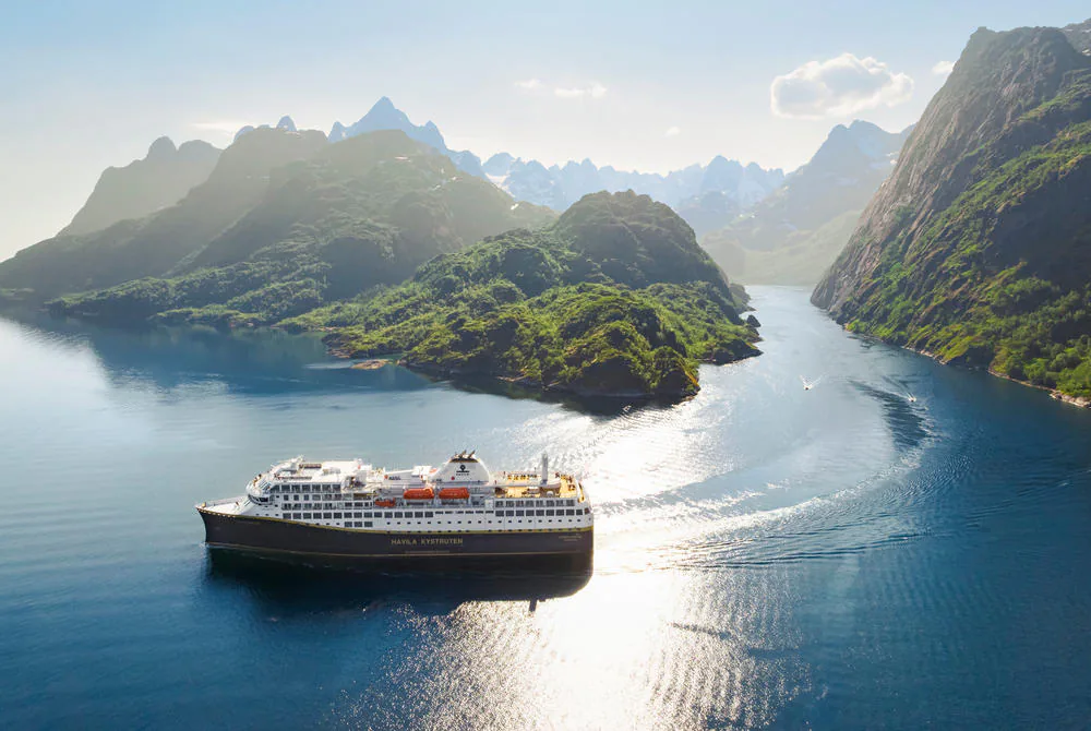 Expedition ship sailing through the Norwegian fjords